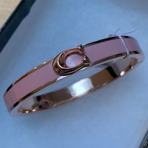 Coach Signature Push Hinge Bangle